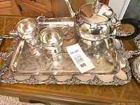Full view of tray with teapot, sugar bowl, creamer and plate
