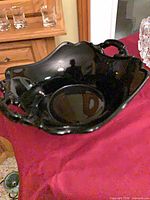 Black glass handled bowl, overall view