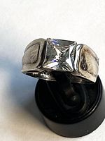 Front view of sterling silver ring with square quartz stone