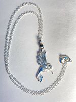 Necklace laid out showing pendant and chain