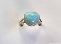 Front view of sterling silver ring with heart-shaped larimar stone