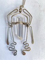 Front view of sterling wire wrapped quartz crystal pendant on chain