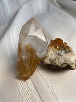 Quartz point and citrine cluster side by side