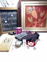 Group shot showing artwork, sign, mittens, mug, trinket box, bag