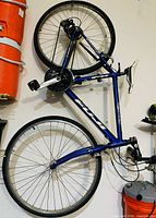 Full view of Fuji Absolute 4.0 bicycle hung on wall