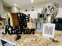 Group shot of all seven kitchen decor items on countertop