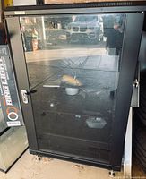 Front view of cabinet with glass door closed