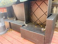 Stacked wicker sectional frames underside view with cushions on top