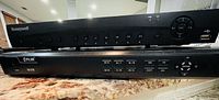 Front view of Honeywell DVR stacked on FLIR NVR