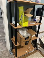 Front view of the four-tier shelf showing shelves and supports