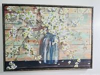 Full view of framed floral artwork on wall