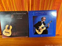 Both album fronts side by side