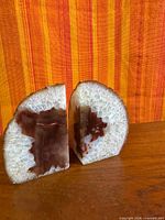Front view of both agate bookend halves showing polished faces and coloration