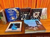 Group shot of all six books showing covers and spines