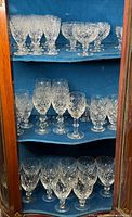 Full cabinet view showing all three types of stemware on shelves