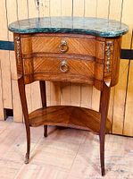 Full view of kidney-shaped side table showing drawers, mounts, shelf, and legs