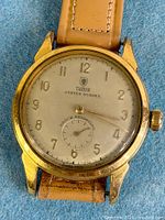 Front view of Tudor Oyster Sussex watch on leather strap