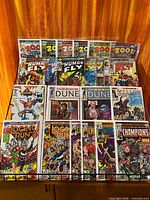 Overall lot of 16 bagged Marvel comics on rack