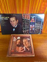 All three Chet Atkins LPs laid out on wood surface showing front covers