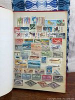 open album page showing numerous aircraft stamps