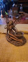 Full view of fairy figurine showing wings and tealight cup