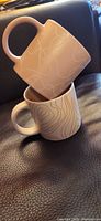 Two mugs stacked showing exterior patterns