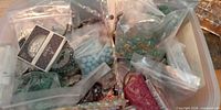 Mixed bead bags and blister packs inside storage bin