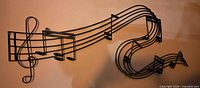 Full view of metal musical staff wall art