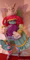 Front view of fairy bunny doll with costume and egg purse