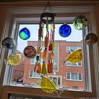 Entire lot hanging in window, showing all ornaments together
