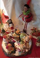 Group shot showing elf, animal head ornaments on mirrored tray, fish and tree ornaments