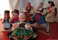All six dolls grouped showing size and costume variety