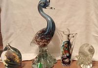 Group shot of all four art glass sculptures