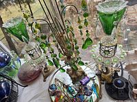 Overall lot showing mirror tray, pendants, lamp toppers, plant stand and art glass balls