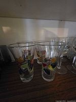 Front view of multicolour tumblers on shelf