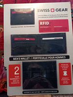 Retail packaging showing wallet, removable sleeve, and gift box with Swiss Gear branding and RFID information