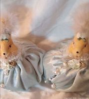 Both bunny figurines front view showing overall design