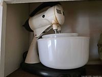 Mixer with milk glass bowls on stand