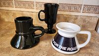 All three mugs on countertop showing styles and colors