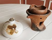 Overall view of both the white ceramic diffuser and terracotta brazier