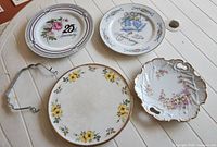 Four plates and metal handle laid out