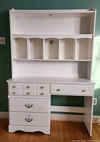 Full view of white desk and hutch set