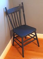 Full view of blue wooden pressback chair