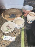 All five pottery pieces grouped on countertop