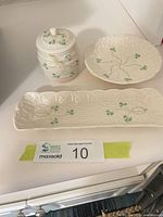 Three Belleek pieces grouped together