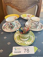 Full lot: three teacups each on saucer plus two extra saucers