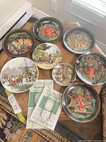 All eight plates plus two hanger packages displayed on floor