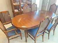 Table with six chairs around it, showing overall style and finish