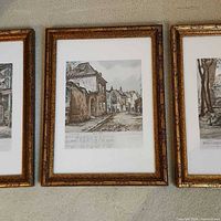 Three framed lithograph prints side by side
