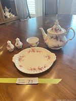 Group shot showing teapot, sugar bowl, handled cake plate, salt and pepper shakers